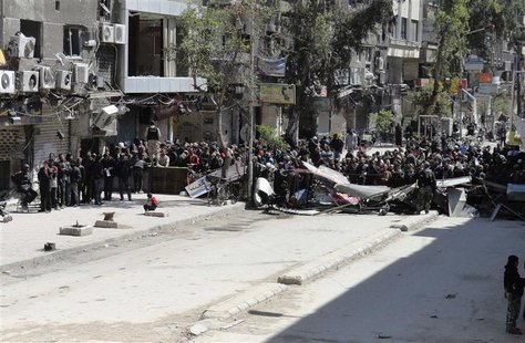 Residents wait to receive food aid distributed by Al-Wafaa campaign at the Palestinian refugee camp of Yarmouk, south of Damascus April 1, 2 Residents wait to receive food aid distributed by Al-Wafaa campaign at the Palestinian refugee camp of Yarmouk, south of Damascus April 1, 2