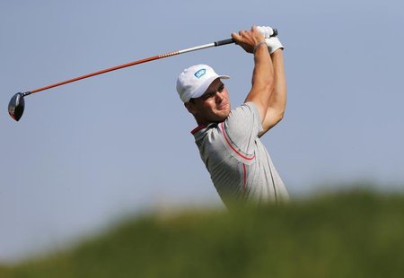 Martin Kaymer of Germany tees off on the third hole during the Abu Dhabi Golf championship January 17, 2014. REUTERS/Ahmed Jadallah Martin Kaymer of Germany tees off on the third hole during the Abu Dhabi Golf championship January 17, 2014. REUTERS/Ahmed Jadallah