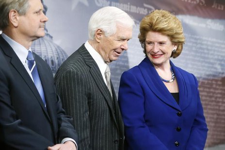 U.S. Senate Agriculture Committee Chairman Debbie Stabenow (D-MI) smiles with ranking member Senator Thad Cochrane (R-MI) (C) at a news conf U.S. Senate Agriculture Committee Chairman Debbie Stabenow (D-MI) smiles with ranking member Senator Thad Cochrane (R-MI) (C) at a news conf