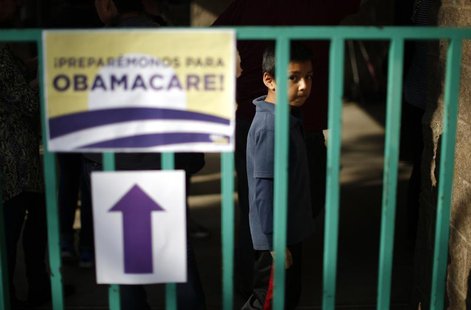A boy waits in line at a health insurance enrollment event in Cudahy, California March 27, 2014. REUTERS/Lucy Nicholson A boy waits in line at a health insurance enrollment event in Cudahy, California March 27, 2014. REUTERS/Lucy Nicholson