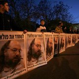 Israeli protesters hold posters calling for the release of Jonathan Pollard, who was imprisoned after being convicted for spying on the Unit Israeli protesters hold posters calling for the release of Jonathan Pollard, who was imprisoned after being convicted for spying on the Unit
