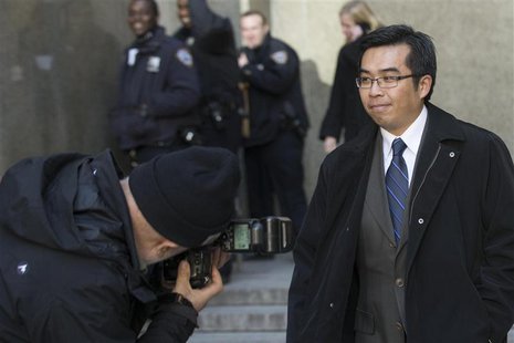 Photographer Sheng Li exits the Manhattan Criminal Court following his hearing in New York, April 1, 2014. REUTERS/Brendan McDermid Photographer Sheng Li exits the Manhattan Criminal Court following his hearing in New York, April 1, 2014. REUTERS/Brendan McDermid