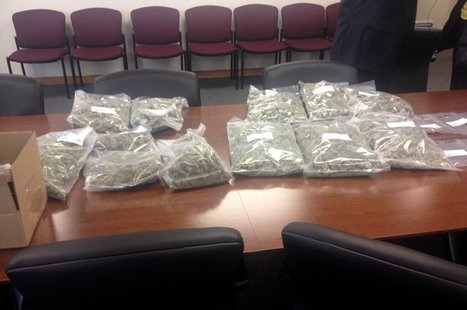 The Brown County Drug Task Force displays bags of marijuana seized in a bust, April 1, 2014. (Photo from: FOX 11). The Brown County Drug Task Force displays bags of marijuana seized in a bust, April 1, 2014. (Photo from: FOX 11).