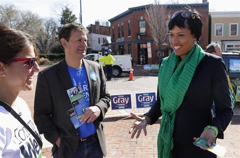 Councilmember Muriel Bowser (R) talks to people in Precinct 89 Eastern Market during the District of Columbia Democratic mayoral primary ele Councilmember Muriel Bowser (R) talks to people in Precinct 89 Eastern Market during the District of Columbia Democratic mayoral primary ele