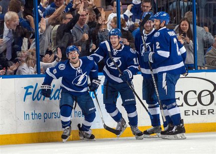 Apr 1, 2014; Tampa, FL, USA; Tampa Bay Lightning defenseman Eric Brewer (2) celebrates scoring a goal with right wing Teddy Purcell (16), ri Apr 1, 2014; Tampa, FL, USA; Tampa Bay Lightning defenseman Eric Brewer (2) celebrates scoring a goal with right wing Teddy Purcell (16), ri