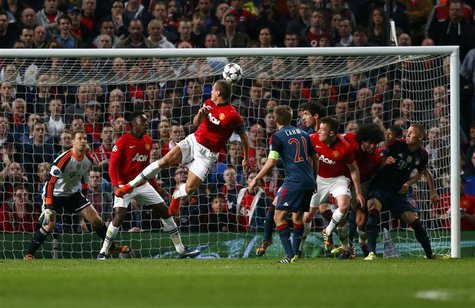 Manchester United's Nemanja Vidic (C) scores a goal against Bayern Munich during their Champions League quarter-final first leg soccer match Manchester United's Nemanja Vidic (C) scores a goal against Bayern Munich during their Champions League quarter-final first leg soccer match