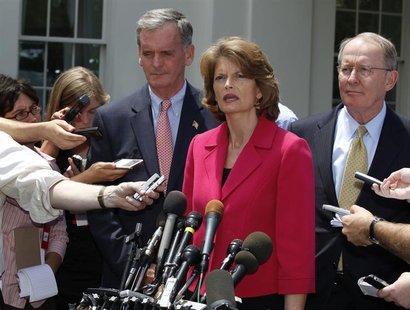 U.S. Sen. Lamar Alexander (R), U.S. Sen. Lisa Murkowski (2nd R), and U.S. Sen. Judd Gregg (3rd R) talk after meeting with U.S. President Bar U.S. Sen. Lamar Alexander (R), U.S. Sen. Lisa Murkowski (2nd R), and U.S. Sen. Judd Gregg (3rd R) talk after meeting with U.S. President Bar