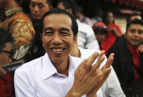 Jakarta governor and presidential candidate Joko Widodo, of the Indonesian Democratic Party of Struggle (PDI-P), reacts during a party campa Jakarta governor and presidential candidate Joko Widodo, of the Indonesian Democratic Party of Struggle (PDI-P), reacts during a party campa