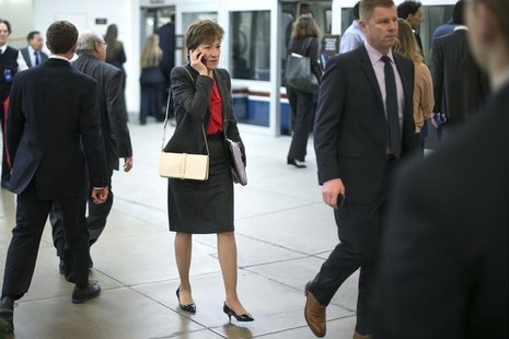 U.S. Senator Susan Collins (R-ME) (C) talks on a mobile phone as she arrives for the weekly Republican caucus luncheon at the U.S. Capitol i U.S. Senator Susan Collins (R-ME) (C) talks on a mobile phone as she arrives for the weekly Republican caucus luncheon at the U.S. Capitol i