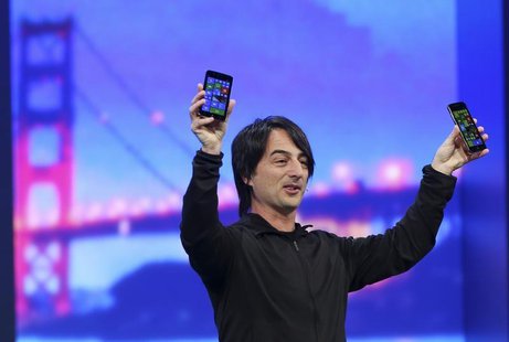 Joe Belfiore, vice president of the operating system group at Microsoft, holds a pair of mobile phones featuring the new Windows 8.1 operati Joe Belfiore, vice president of the operating system group at Microsoft, holds a pair of mobile phones featuring the new Windows 8.1 operati