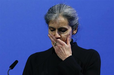 Fabienne Wauthier, widow of Zurich Insurance finance chief Pierre Wauthier reacts as she addresses the company's annual shareholder meeting Fabienne Wauthier, widow of Zurich Insurance finance chief Pierre Wauthier reacts as she addresses the company's annual shareholder meeting