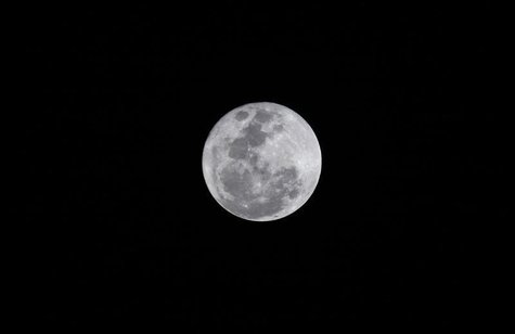 The full moon as seen over Lagos December 17, 2013. REUTERS/Akintunde Akinleye The full moon as seen over Lagos December 17, 2013. REUTERS/Akintunde Akinleye