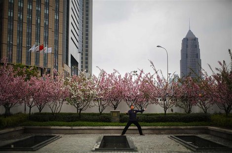 A man practices Tai Chi in a park at Pudong financial district in Shanghai April 2, 2014. REUTERS/Carlos Barria A man practices Tai Chi in a park at Pudong financial district in Shanghai April 2, 2014. REUTERS/Carlos Barria