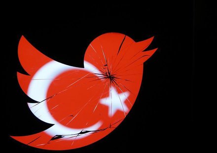 A Turkish national flag is seen through a broken Twitter logo in this photo illustration taken in Zenica, March 21, 2014. REUTERS/Dado Ruvic A Turkish national flag is seen through a broken Twitter logo in this photo illustration taken in Zenica, March 21, 2014. REUTERS/Dado Ruvic