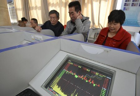 Investors look at computer screens showing stock information at a brokerage house in Fuyang, Anhui province March 21, 2014. REUTERS/China Da Investors look at computer screens showing stock information at a brokerage house in Fuyang, Anhui province March 21, 2014. REUTERS/China Da