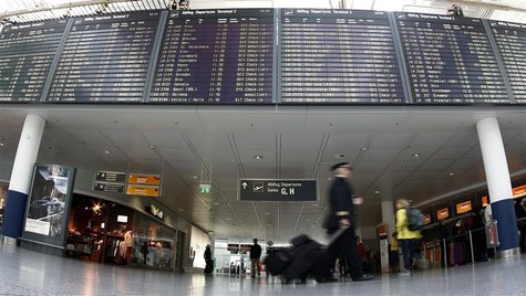 Pilots walk past a flight schedule board announcing cancelled flights of German airline Lufthansa at Munich's airport April 2, 2014. REUTERS Pilots walk past a flight schedule board announcing cancelled flights of German airline Lufthansa at Munich's airport April 2, 2014. REUTERS