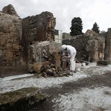 A restorer works in the ancient Roman city Pompeii, which was buried in AD 79 by an eruption of the Vesuvius volcano, February 6, 2013. REUT A restorer works in the ancient Roman city Pompeii, which was buried in AD 79 by an eruption of the Vesuvius volcano, February 6, 2013. REUT