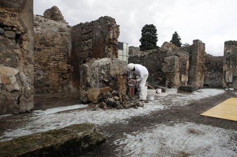 A restorer works in the ancient Roman city Pompeii, which was buried in AD 79 by an eruption of the Vesuvius volcano, February 6, 2013. REUT A restorer works in the ancient Roman city Pompeii, which was buried in AD 79 by an eruption of the Vesuvius volcano, February 6, 2013. REUT