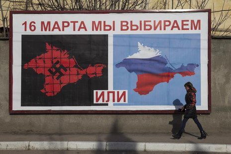 A woman walking by a poster calling people to vote in the upcoming referendum, in the Crimean port city of Sevastopol March 10, 2014. REUTER A woman walking by a poster calling people to vote in the upcoming referendum, in the Crimean port city of Sevastopol March 10, 2014. REUTER