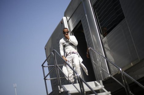 Mercedes Formula One driver Lewis Hamilton of Britain walks down stairs during the second practice session of the Italian F1 Grand Prix at t Mercedes Formula One driver Lewis Hamilton of Britain walks down stairs during the second practice session of the Italian F1 Grand Prix at t