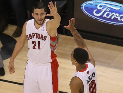 Apr 2, 2014; Toronto, Ontario, CAN; Toronto Raptors guard DeMar DeRozan (10) is congratulated by guard Greivis Vasquez (21) after scoring a Apr 2, 2014; Toronto, Ontario, CAN; Toronto Raptors guard DeMar DeRozan (10) is congratulated by guard Greivis Vasquez (21) after scoring a