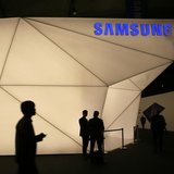 Visitors walk past the Samsung stand at the Mobile World Congress in Barcelona February 24, 2014. REUTERS/Gustau Nacarino Visitors walk past the Samsung stand at the Mobile World Congress in Barcelona February 24, 2014. REUTERS/Gustau Nacarino