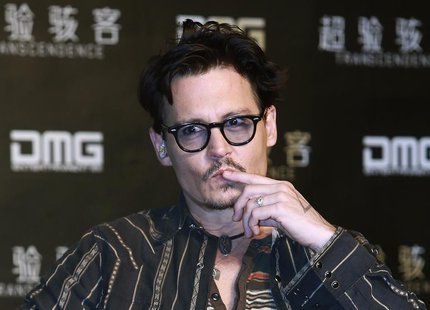 Actor Johnny Depp gestures during a promotional event of his new movie "Transcendence", on his first visit to China in Beijing, March 31, 20 Actor Johnny Depp gestures during a promotional event of his new movie "Transcendence", on his first visit to China in Beijing, March 31, 20