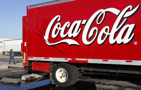 A woman walks past a Coca-Cola truck truck at a distribution center in Alexandria, Virginia October 16, 2012. REUTERS/Kevin Lamarque A woman walks past a Coca-Cola truck truck at a distribution center in Alexandria, Virginia October 16, 2012. REUTERS/Kevin Lamarque