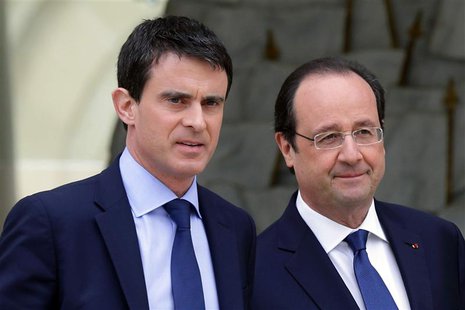 French President Francois Hollande (R) escorts newly-named Prime Minister Manuels Valls after the first cabinet meeting of the new governmen French President Francois Hollande (R) escorts newly-named Prime Minister Manuels Valls after the first cabinet meeting of the new governmen