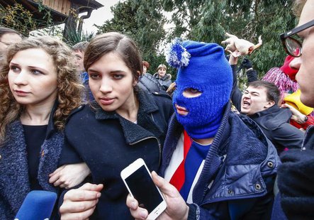 Russian punk band Pussy Riot members Maria Alyokhina (L) and Nadezhda Tolokonnikova (2nd L) along with a masked member speak to journalists during the 2014 Sochi Winter Olympics, in Adler February 20, 2014. REUTERS/Shamil Zhumatov Russian punk band Pussy Riot members Maria Alyokhina (L) and Nadezhda Tolokonnikova (2nd L) along with a masked member speak to journalists during the 2014 Sochi Winter Olympics, in Adler February 20, 2014. REUTERS/Shamil Zhumatov