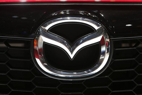 The company logo is seen on the bonnet of a Mazda car during the media day ahead of the 84th Geneva Motor Show at the Palexpo Arena in Genev The company logo is seen on the bonnet of a Mazda car during the media day ahead of the 84th Geneva Motor Show at the Palexpo Arena in Genev