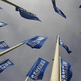Samsung flags are set up at the main entrance to the Berlin fair ground before the IFA consumer electronics fair in Berlin, August 28, 2012. Samsung flags are set up at the main entrance to the Berlin fair ground before the IFA consumer electronics fair in Berlin, August 28, 2012.