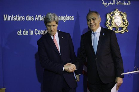 U.S. Secretary of State John Kerry (L) shakes hands with Moroccan Foreign Minister Salaheddine Mezouar at a news conference following a bila U.S. Secretary of State John Kerry (L) shakes hands with Moroccan Foreign Minister Salaheddine Mezouar at a news conference following a bila