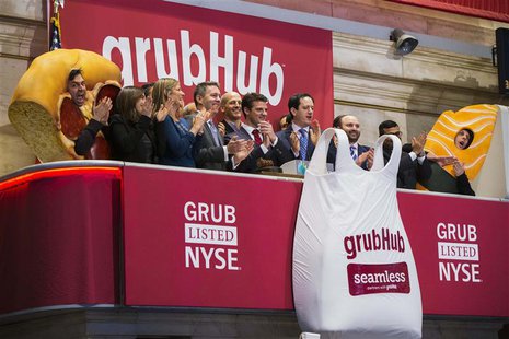 GrubHub CEO Matt Maloney (C) applauds after ringing the opening bell before the company's IPO on the floor of the New York Stock Exchange in GrubHub CEO Matt Maloney (C) applauds after ringing the opening bell before the company's IPO on the floor of the New York Stock Exchange in