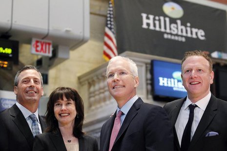 Hillshire Brands CEO Sean Connolly (2nd-R) poses with company executives on the floor of the New York Stock Exchange, July 3, 2012. REUTERS/ Hillshire Brands CEO Sean Connolly (2nd-R) poses with company executives on the floor of the New York Stock Exchange, July 3, 2012. REUTERS/
