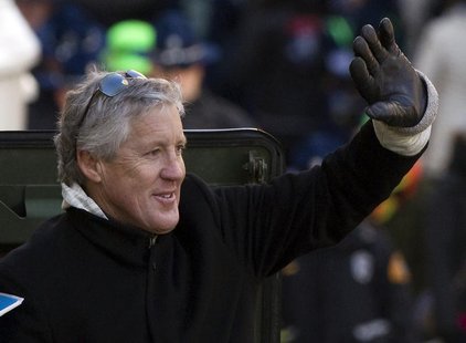 Seattle Seahawks head coach Pete Carroll waves to fans during the NFL team's Super Bowl victory parade in Seattle, Washington February 5, 20 Seattle Seahawks head coach Pete Carroll waves to fans during the NFL team's Super Bowl victory parade in Seattle, Washington February 5, 20
