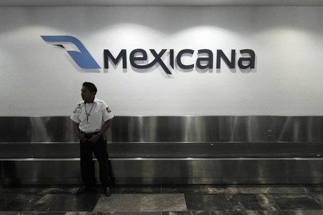 A security guard stands behind a counter of Mexicana de Aviacion at Cancun's international airport August 28, 2010. REUTERS/Gerardo Garcia A security guard stands behind a counter of Mexicana de Aviacion at Cancun's international airport August 28, 2010. REUTERS/Gerardo Garcia