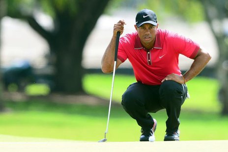 Mar 9, 2014; Miami, FL, USA; Tiger Woods lines up a putt on the 2nd green during the final round of the WGC - Cadillac Championship golf tou Mar 9, 2014; Miami, FL, USA; Tiger Woods lines up a putt on the 2nd green during the final round of the WGC - Cadillac Championship golf tou