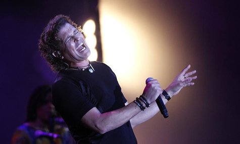 Colombian singer and composer Carlos Vives performs during the 55th International Song Festival in Vina del Mar city, about 121km (75 miles) Colombian singer and composer Carlos Vives performs during the 55th International Song Festival in Vina del Mar city, about 121km (75 miles)
