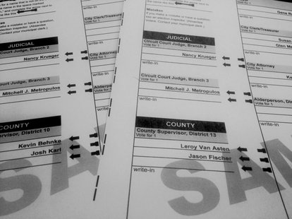 Two sample ballots with two different county board races is seen on April 2, 2014. (Photo from: FOX 11). Two sample ballots with two different county board races is seen on April 2, 2014. (Photo from: FOX 11).