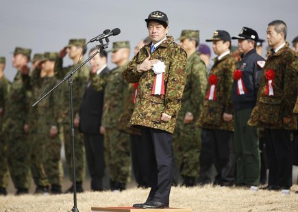 Japan's Defence Minister Itsunori Onodera (C) reviews troops from the Japanese Ground Self-Defense Force 1st Airborne Brigade during an annu Japan's Defence Minister Itsunori Onodera (C) reviews troops from the Japanese Ground Self-Defense Force 1st Airborne Brigade during an annu
