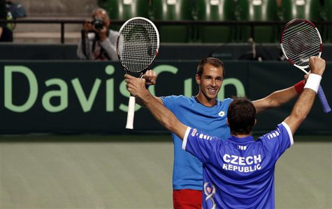 Lukas Rosol (facing camera) and Radek Stepanek of the Czech Republic celebrate after winning their Davis Cup men's doubles quarter-final ten Lukas Rosol (facing camera) and Radek Stepanek of the Czech Republic celebrate after winning their Davis Cup men's doubles quarter-final ten