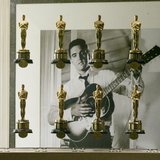A photograph of the late singer and actor Elvis Presley is framed by a portion of the Academy Awards bestowed upon films from movie studio M A photograph of the late singer and actor Elvis Presley is framed by a portion of the Academy Awards bestowed upon films from movie studio M