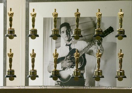 A photograph of the late singer and actor Elvis Presley is framed by a portion of the Academy Awards bestowed upon films from movie studio M A photograph of the late singer and actor Elvis Presley is framed by a portion of the Academy Awards bestowed upon films from movie studio M