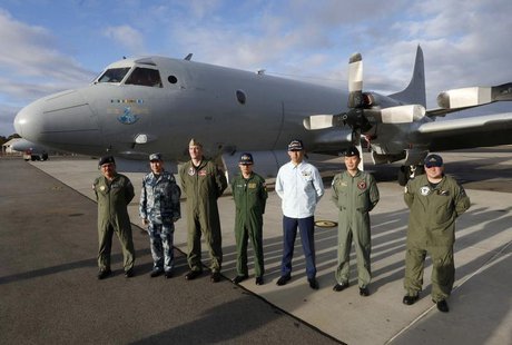 Leaders of the international forces currently based in Perth to search for Malaysia Airlines flight MH370 stand in front of a Royal Australi Leaders of the international forces currently based in Perth to search for Malaysia Airlines flight MH370 stand in front of a Royal Australi
