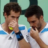 Britain's Andy Murray (L) chats with teammate Colin Fleming during their Davis Cup quarter-final doubles tennis match against Italy's Fabio Britain's Andy Murray (L) chats with teammate Colin Fleming during their Davis Cup quarter-final doubles tennis match against Italy's Fabio