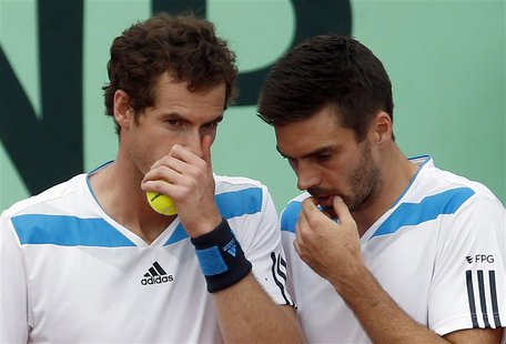 Britain's Andy Murray (L) chats with teammate Colin Fleming during their Davis Cup quarter-final doubles tennis match against Italy's Fabio Britain's Andy Murray (L) chats with teammate Colin Fleming during their Davis Cup quarter-final doubles tennis match against Italy's Fabio