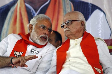 A leader of India's main opposition Bharatiya Janata Party (BJP), Lal Krishna Advani (R), listens to BJP prime ministerial candidate Narendr A leader of India's main opposition Bharatiya Janata Party (BJP), Lal Krishna Advani (R), listens to BJP prime ministerial candidate Narendr