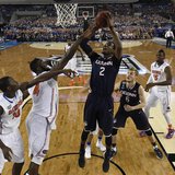 Apr 5, 2014; Arlington, TX, USA; Connecticut Huskies forward DeAndre Daniels (2) shoots the ball against Florida Gators center Patric Young Apr 5, 2014; Arlington, TX, USA; Connecticut Huskies forward DeAndre Daniels (2) shoots the ball against Florida Gators center Patric Young