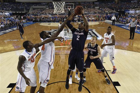 Apr 5, 2014; Arlington, TX, USA; Connecticut Huskies forward DeAndre Daniels (2) shoots the ball against Florida Gators center Patric Young Apr 5, 2014; Arlington, TX, USA; Connecticut Huskies forward DeAndre Daniels (2) shoots the ball against Florida Gators center Patric Young